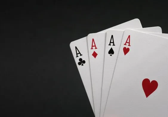 Four Aces in black background